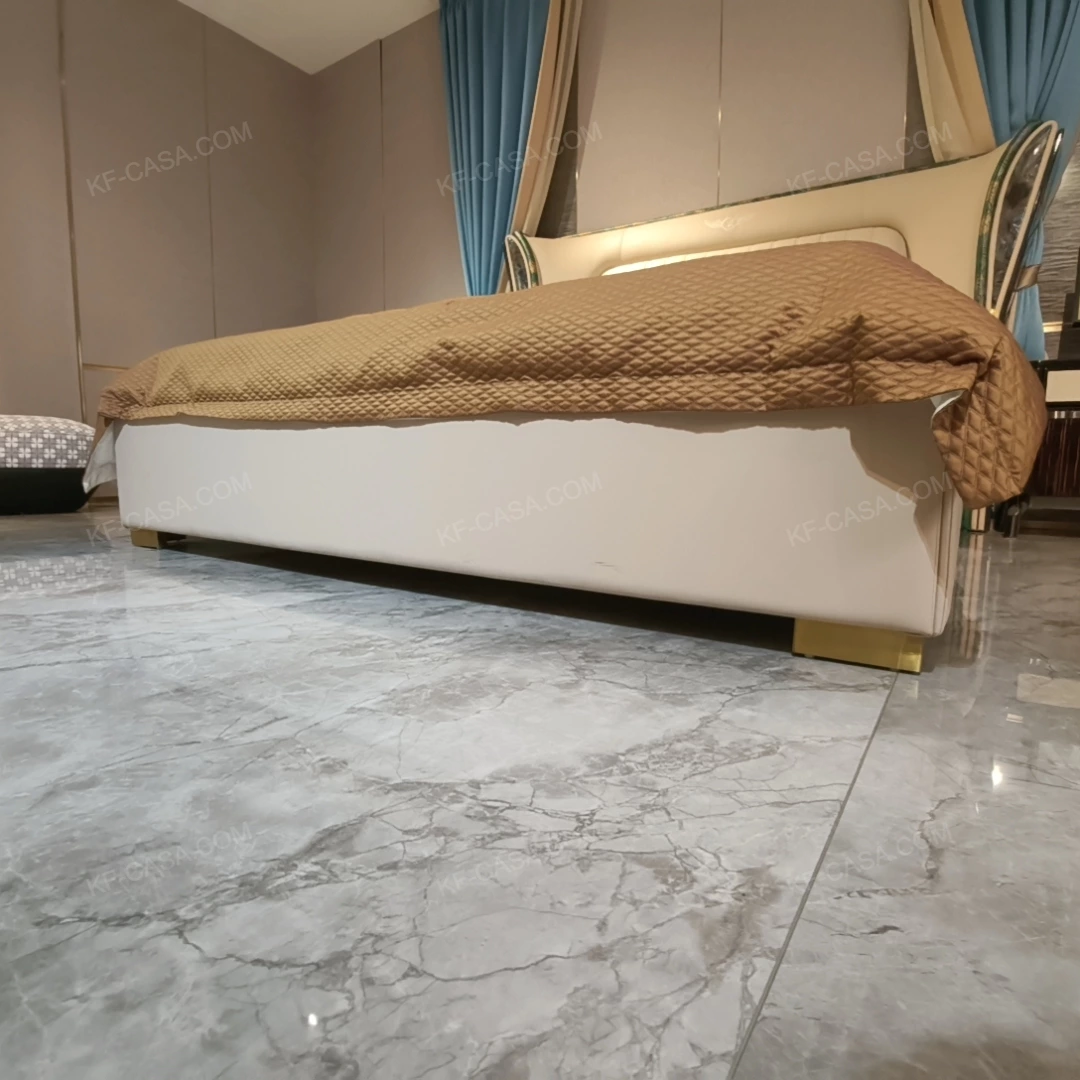 Cream Upholstered Bed with Decorative Accent Trim, Brand Emblem & Gold Stainless Steel Feet